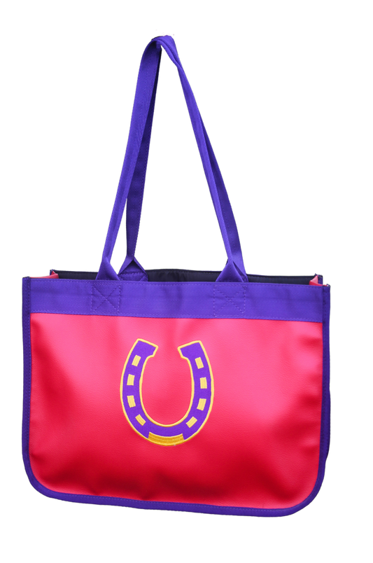 A red and blue paddock bag with a large yellow horseshoe logo on the front and purple straps.
