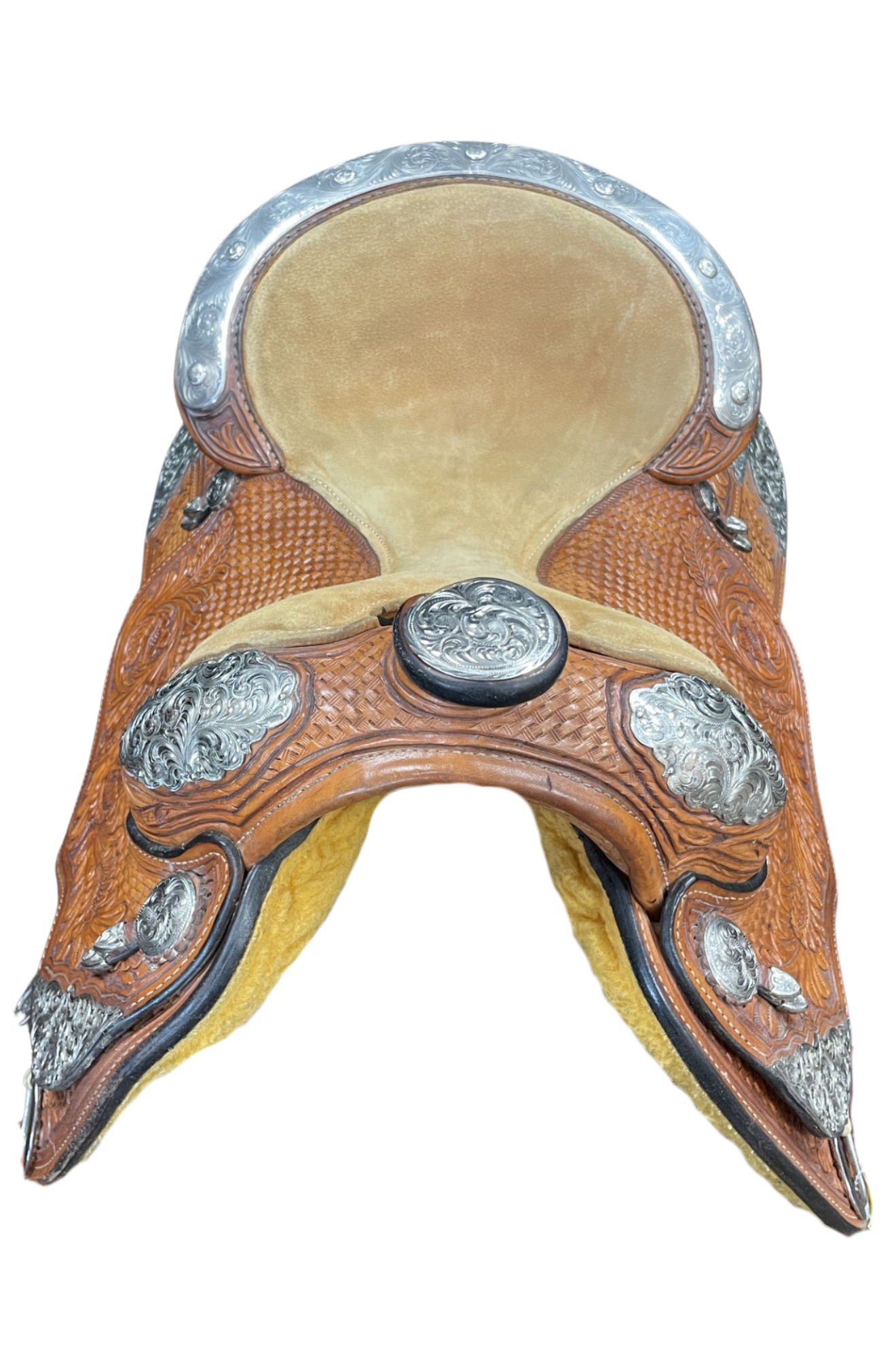Decorative horse saddle with leather and metal details on a white background