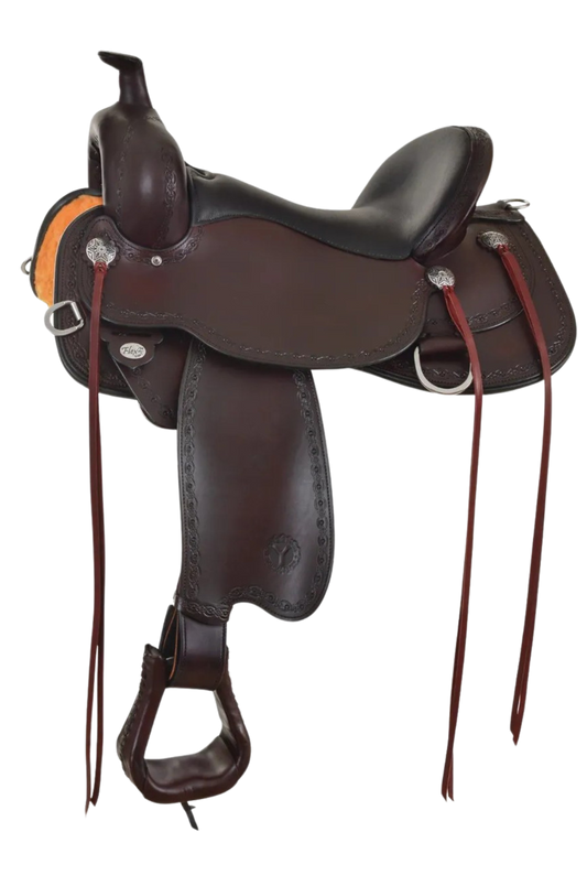 A brown Circle Y Alpine Flex 2 trail saddle with engraved stainless steel conchos and stainless steel hardware, featuring a cutout skirt shape and a 3-way adjustable in-skirt rigging.