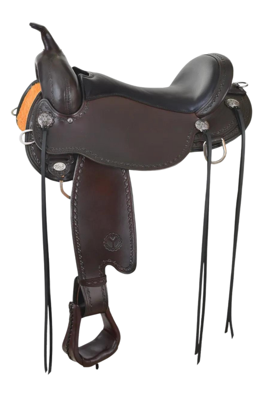 A black Circle Y Salt River Flex2 Trail Saddle with engraved stainless steel conchos and leather laced ErgoBalance Stirrups.