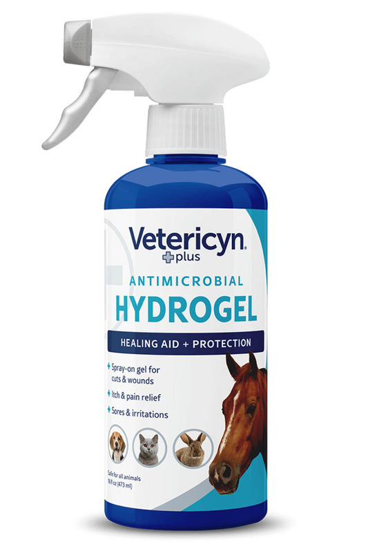 A bottle of Vetericyn Antimicrobial Hydrogel Spray with a white spray nozzle on a plain background.