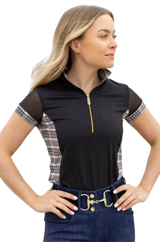 Woman wearing a black equestrian shirt with plaid sleeves on a white background