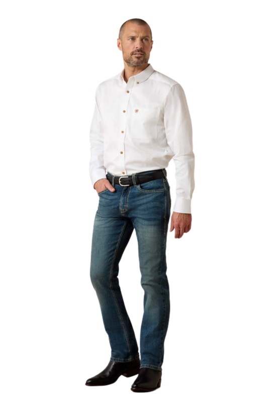 Man wearing a white dress shirt, blue jeans, and black shoes on a white background