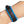 Blue and brown leather bracelet on a wrist against a white background