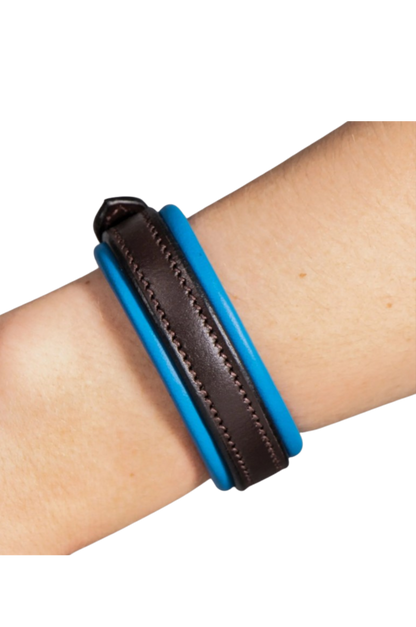 Blue and brown leather bracelet on a wrist against a white background