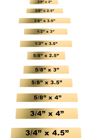 A series of rectangular brass plates in various sizes with engraved text.