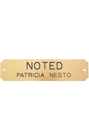 A series of rectangular brass plates in various sizes with engraved text.