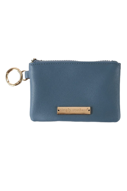 A brown faux leather coin purse with a zipper closure and a metal key ring attached.