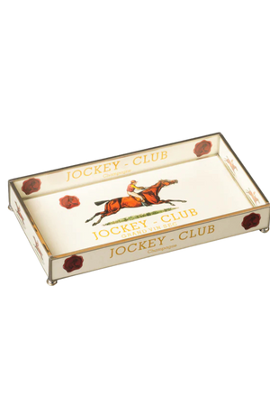 A rectangular silver serving tray with the Jockey Club logo and a depiction of a horse and jockey in the center, surrounded by red and gold decorative elements.
