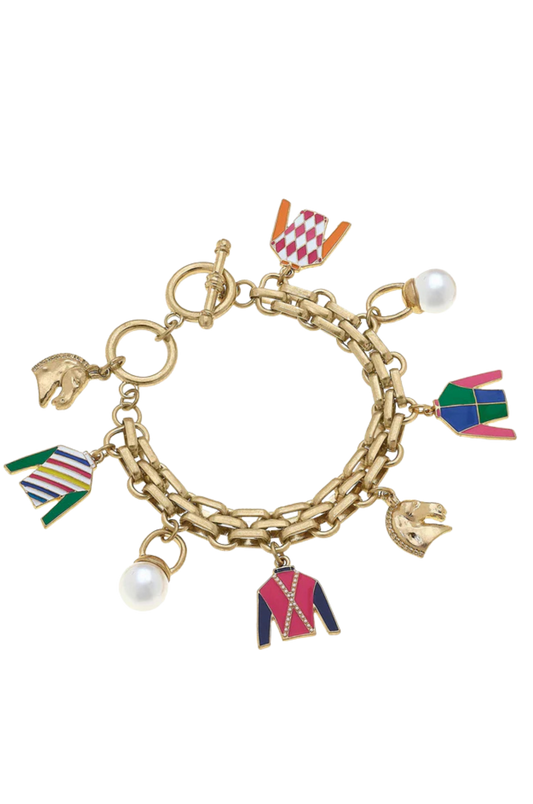 A gold-plated charm bracelet with multiple colorful enamel charms, some shaped like jockey silks, and pearl accents.