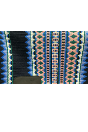 A close-up view of a show pad with a geometric pattern featuring diamond shapes in blue, black, and multicolor shades.