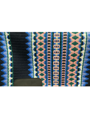 A close-up view of a show pad with a geometric pattern featuring diamond shapes in blue, black, and multicolor shades.