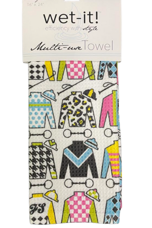 A multicolored kitchen towel with a racing silks design, featuring patterns resembling horse racing outfits, packaged with a 'wet-it! multi-use towel' label.