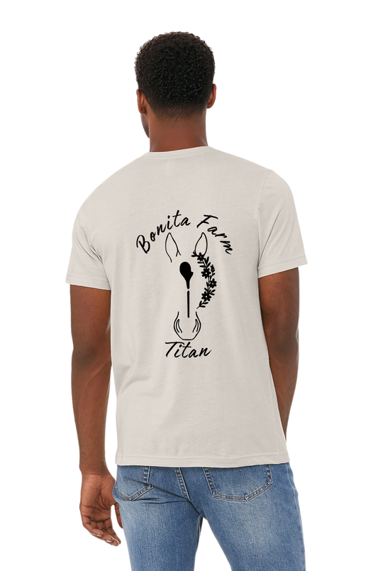 Person wearing a white t-shirt with 'Bonita Farm Titan' design on the back, standing against a white background.