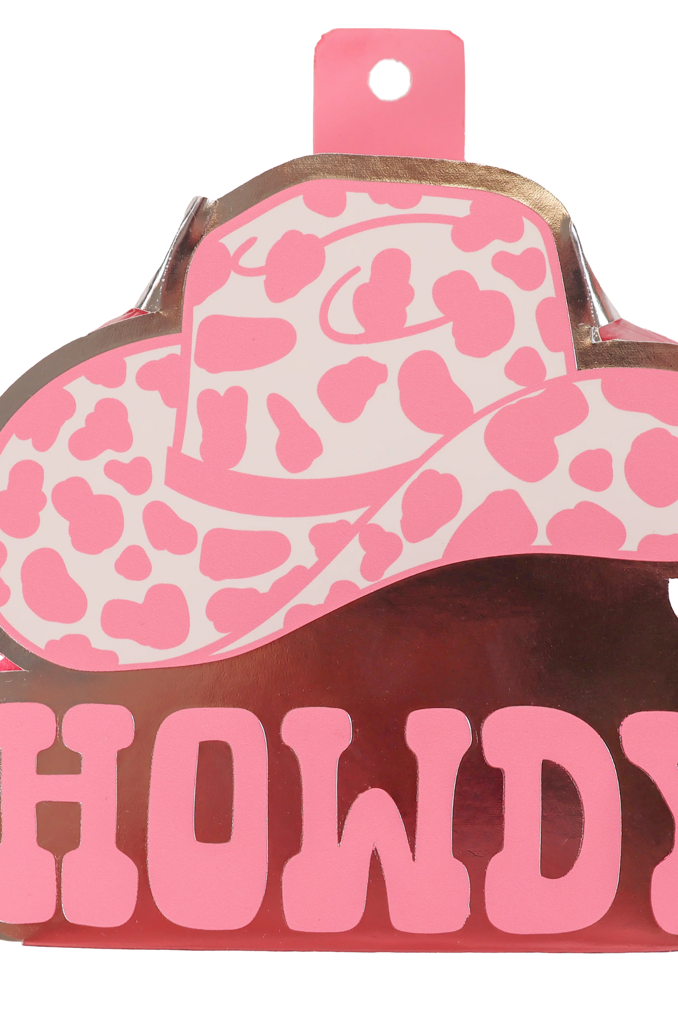 A bath sponge with a cow pattern and a pink bow.