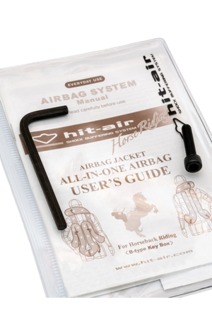 Hit-Air airbag system instruction booklet and tool kit, including a CO2 cartridge replacement tool, packaged in a clear plastic cover.