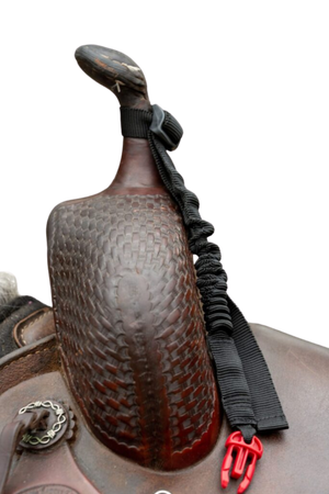 A black bungee lanyard attached to a Western saddle, designed to hold a vest securely in place.