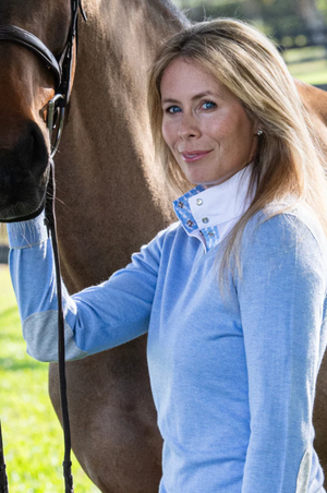 Blue sweater with elbow patches on a white background