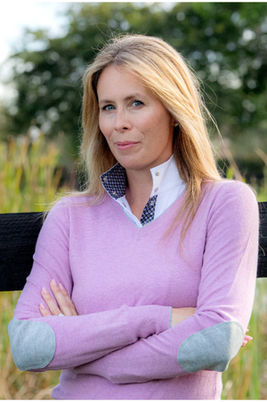 Purple sweater with elbow patches on a white background