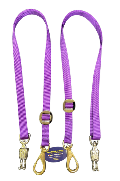 Two purple cross ties with gold hardware on a white background