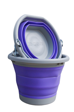 A purple and grey BOSS BUCKET with a hard plastic rim and bottom and a thick silicone middle, designed to lay flat.
