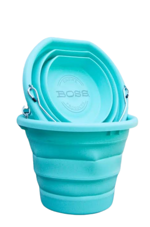 A teal BOSS BUCKET with a hard plastic rim and bottom and a thick silicone middle, designed to lay flat.