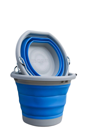 A blue and grey BOSS BUCKET with a hard plastic rim and bottom and a thick silicone middle, designed to lay flat.