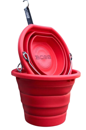 A red BOSS BUCKET with a hard plastic rim and bottom and a thick silicone middle, designed to lay flat.