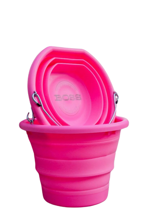 A pink BOSS BUCKET with a hard plastic rim and bottom and a thick silicone middle, designed to lay flat.