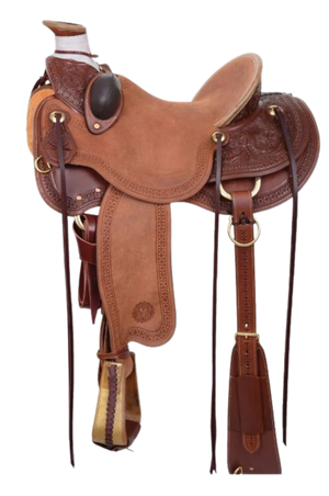 A brown western ranch saddle with floral tooling and black conchos.