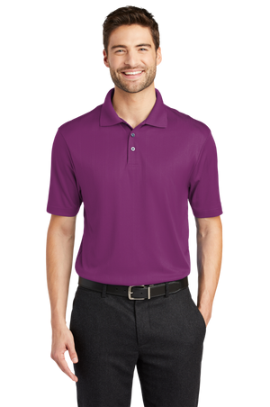 A man wearing a short-sleeved performance polo shirt with a collar, a 3-button placket, and black pants.