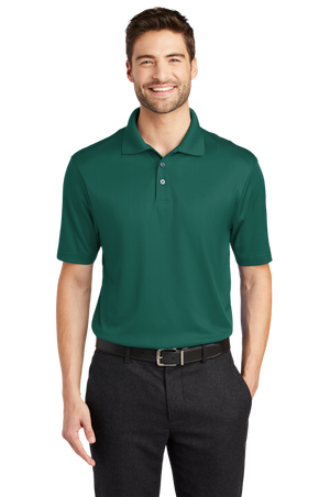 A man wearing a short-sleeved performance polo shirt with a collar, a 3-button placket, and black pants.