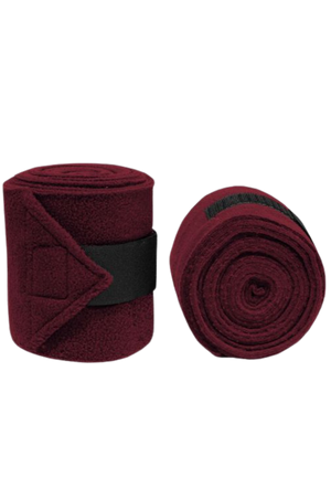 Vac's Deluxe Polo bandages wrapped around a horse's forelimbs, showing the folded ends with hook and loop fasteners.