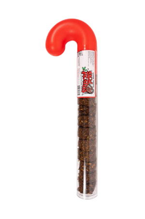 A clear tube with horse treats visible inside, topped with a red candy cane-like cap, labeled as Stud Muffins brand.