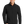 A man wearing a gray softshell jacket with a zip-through cadet collar, chin guard, and front zippered pockets.