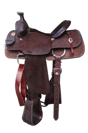 A brown leather saddle designed for roper riding style with pre-turned fenders and a groundseat.