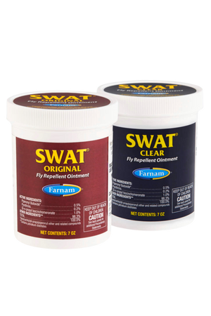 Two containers of SWAT fly repellent ointment, one labeled as SWAT Original in pink, and the other as SWAT Clear in blue, both with red text and branding.