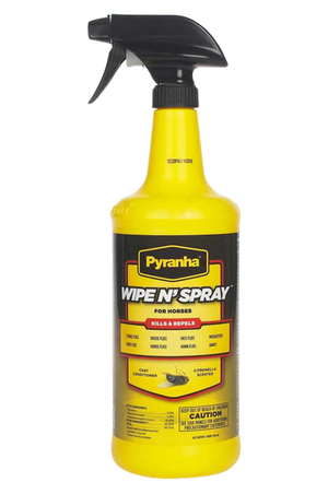 A yellow spray bottle labeled 'Pyranha Wipe N' Spray' with black text, used for animal fly protection and coat conditioning.