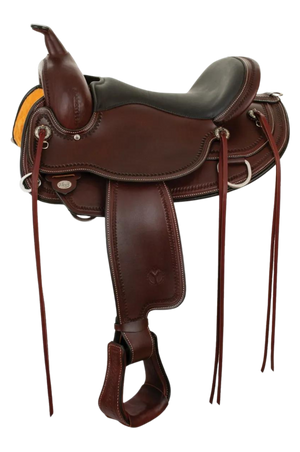 A brown Circle Y Omaha Flex2 Trail saddle with a rigging system, shell tooling, and silver conchos.