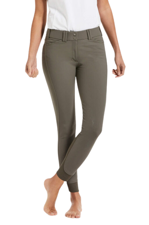 A pair of navy blue knee patch riding breeches with a white belt and white shirt, designed for equestrian activities.