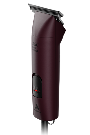 A set of ANDIS clippers in red color with a blade attached and a power cord, designed for animal grooming.