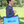 A red and blue paddock bag with a large yellow horseshoe logo on the front and purple straps.