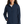A woman wearing a navy softshell jacket with a zip-through cadet collar, chin guard, and front zippered pockets.