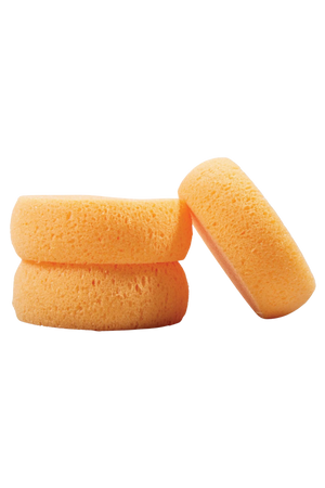 Three orange-colored round tack sponges stacked on top of each other against a white background.