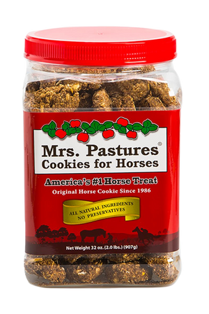 A plastic jar of Mrs. Pastures Cookies for Horses, with a red lid and Christmas-themed decoration on the label.