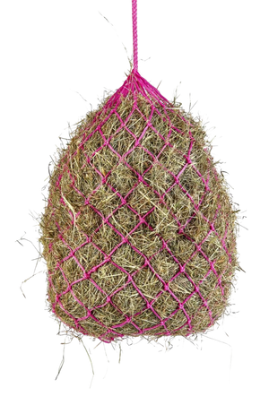 A pink haylage net filled with hay.