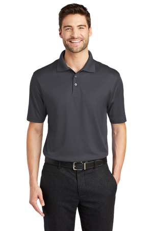 A man wearing a short-sleeved performance polo shirt with a collar, a 3-button placket, and black pants.