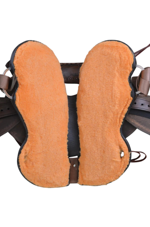 A brown western saddle with sunflower hand-tooling and turquoise patina copper berry hardware.