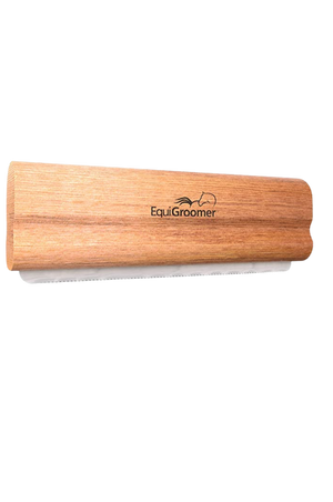 A pink EquiGroomer pet grooming tool with a wave-style blade, designed for removing fur and dirt from pets.