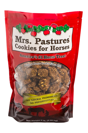 A plastic jar of Mrs. Pastures Cookies for Horses, with a red lid and Christmas-themed decoration on the label.